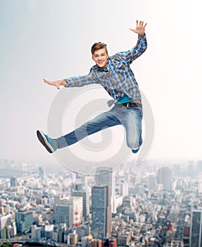 Smiling young man jumping in air