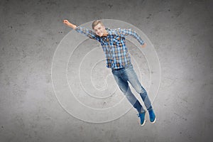 Smiling young man jumping in air