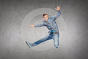 Smiling young man jumping in air