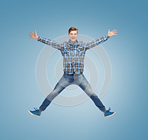 Smiling young man jumping in air