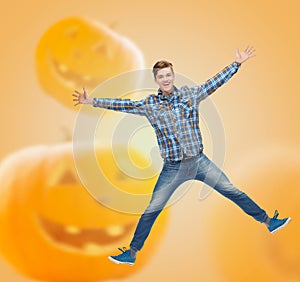 Smiling young man jumping in air