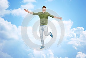 Smiling young man jumping in air