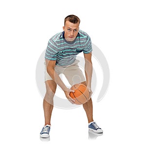 Smiling young man playing basketball