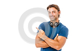 Smiling young man pointing copy space
