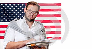 Smiling young man on United States flag background.