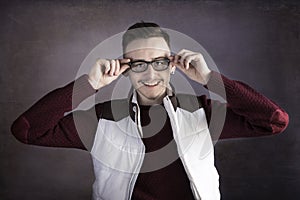 Smiling young man wearing glasses