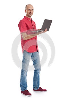 Smiling young man working on his laptop