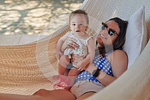 Smiling young mom with baby