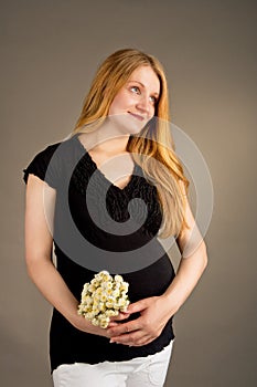 Smiling young pregnant blonde