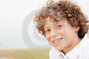 Smiling young pretty boy posing