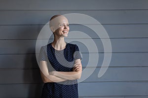 Smiling young sick woman dream of cancer recovery