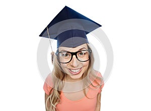 Smiling young student woman in mortarboard