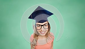 Smiling young student woman in mortarboard