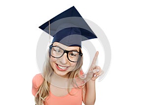 Smiling young student woman in mortarboard