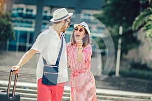 Young travellers couple looking for hotel photo