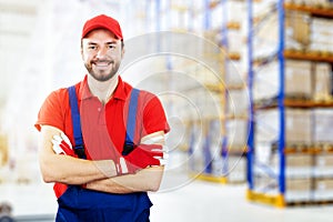 smiling young warehouse worker in red uniform