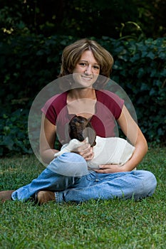 Smiling Young Woman With Baby Goat