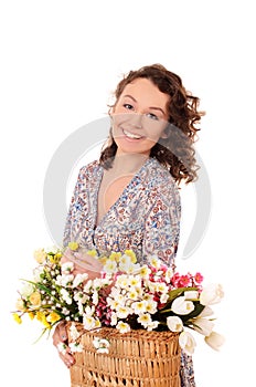 smiling young woman with basket of flowers