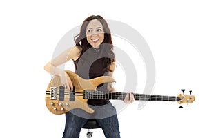 Smiling young woman with a bass guitar