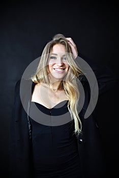 Smiling young woman with black dress