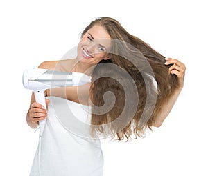 Smiling young woman blow-dry