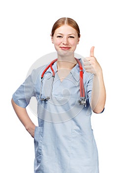 Smiling young woman in blue doctor's smock with red stethoscope