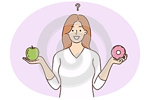 Smiling woman choose between healthy and unhealthy food