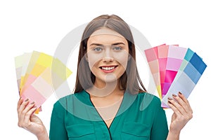 Smiling young woman with color swatches