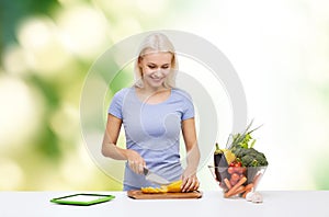 Smiling young woman cooking vegetables