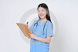 Smiling young woman doctor taking notes making medical with clipboard isolate over white background