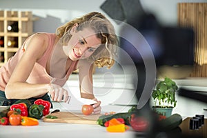 smiling young woman doing cooking vblog