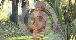 Smiling young woman enjoying a tropical vacation