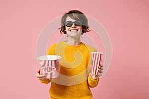 Smiling young woman girl in 3d imax glasses posing isolated on pink background. People in cinema, lifestyle concept photo