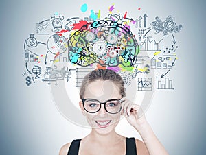 Smiling young woman in glasses, business thinking