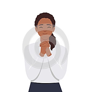 Smiling young woman with hands in prayer ask for forgiveness or beg