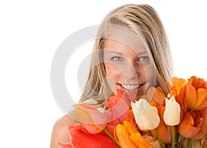 Smiling young woman holding flowers