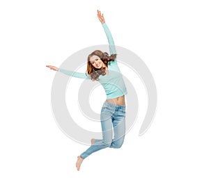 Smiling young woman jumping in air