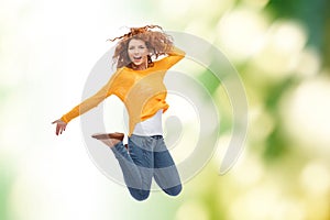 Smiling young woman jumping in air