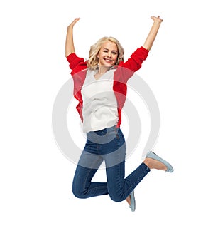 Smiling young woman jumping in air