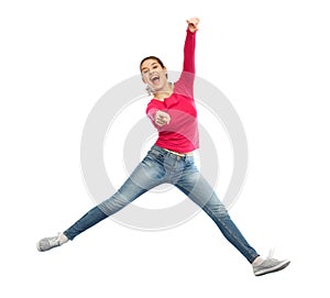 Smiling young woman jumping in air