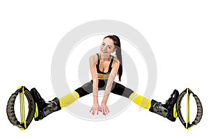 Smiling young woman in a kangoo jumps shoes sitting legs apart.