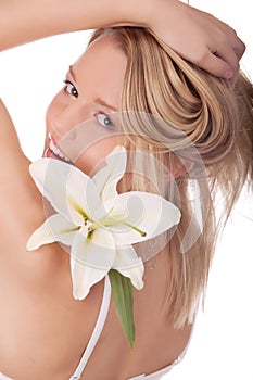 Smiling young woman with natural flowers