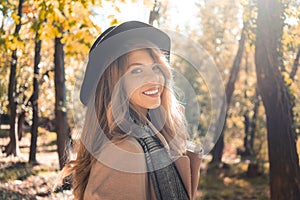 Smiling young woman in park