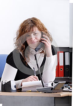 Smiling young woman on the phone