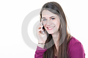 smiling young woman on the phone with her long hair and her broad handsome smile