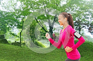 Smiling young woman running outdoors