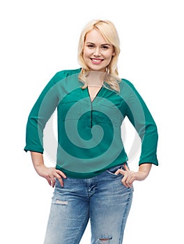 Smiling young woman in shirt and jeans