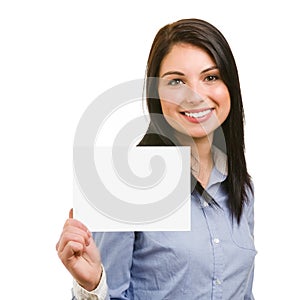 Smiling young woman showing blank signboard