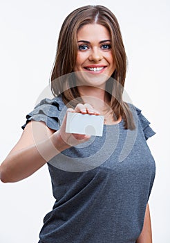 Smiling young woman showing blank signboard