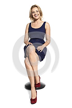 Smiling Young Woman Sitting on Stool